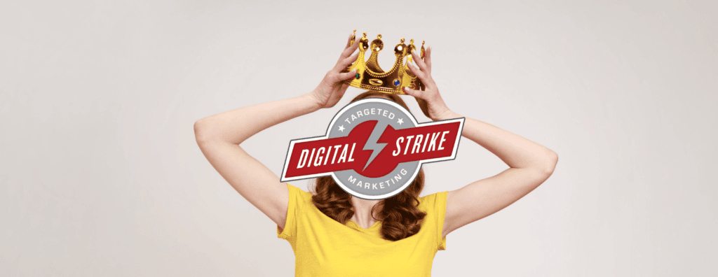 A woman crowns herself. Digital Strike logo overtop her head.