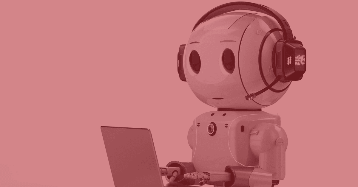 Robot representing AI chatbot ChatGPT works on a laptop. Red filter.