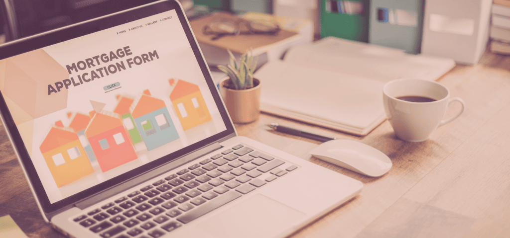 A laptop on a cluttered desk shows a mortgage application form. Represents the concept of how mortgage lending SEO can help mortgage brokers find borrowers online.