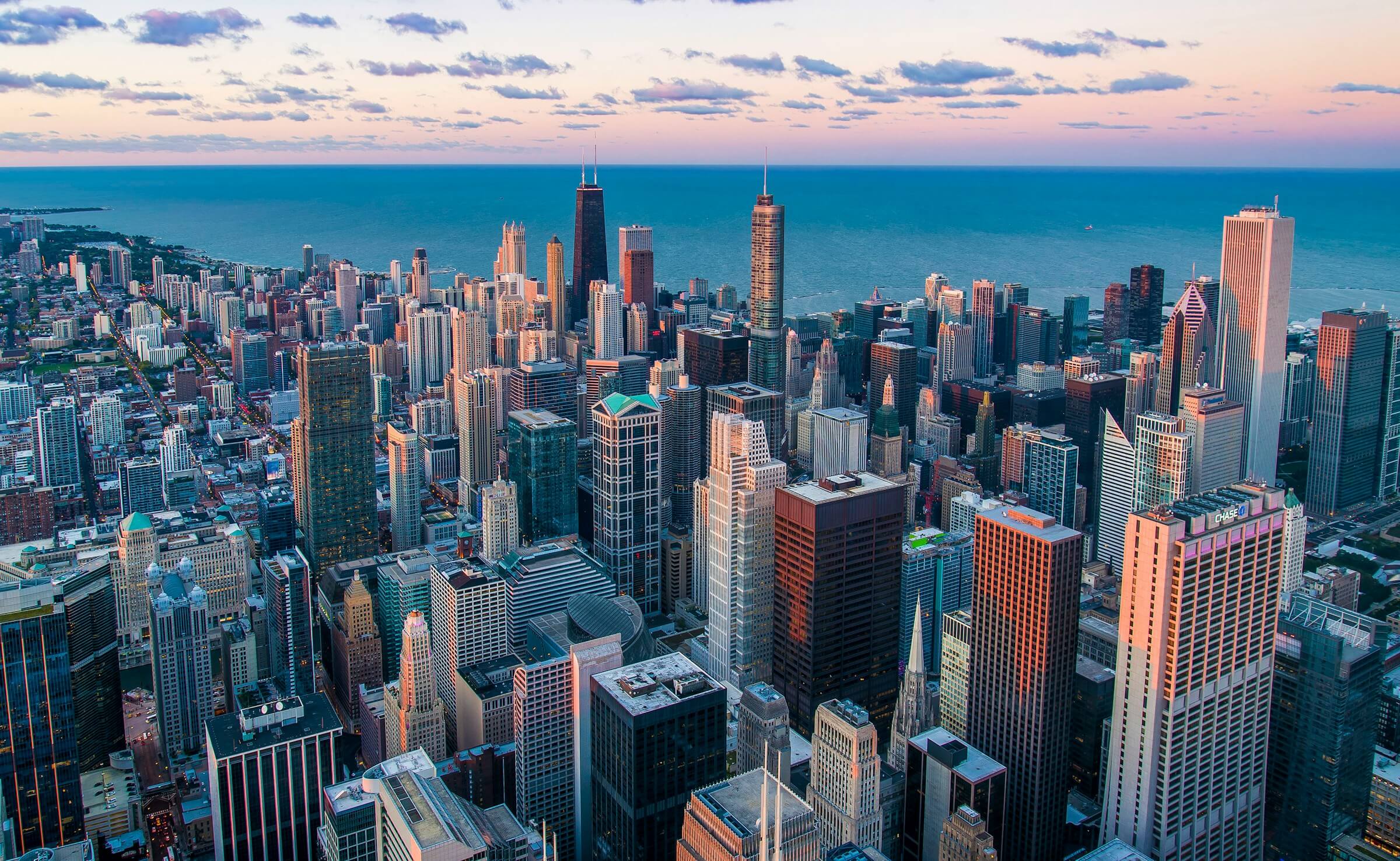 Chicago city architecture and skyscrapers near waterfront. Photo credit Pedro Lastra on Unsplash.