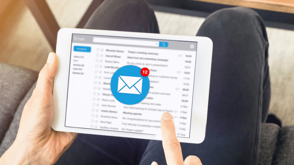 person checking their email on a tablet