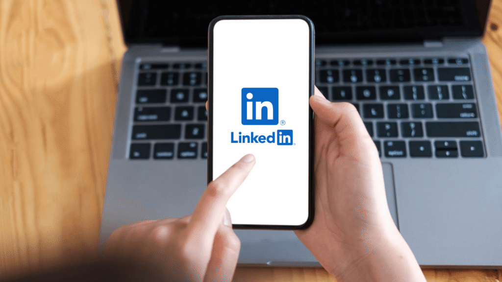 person logging into LinkedIn on their phone